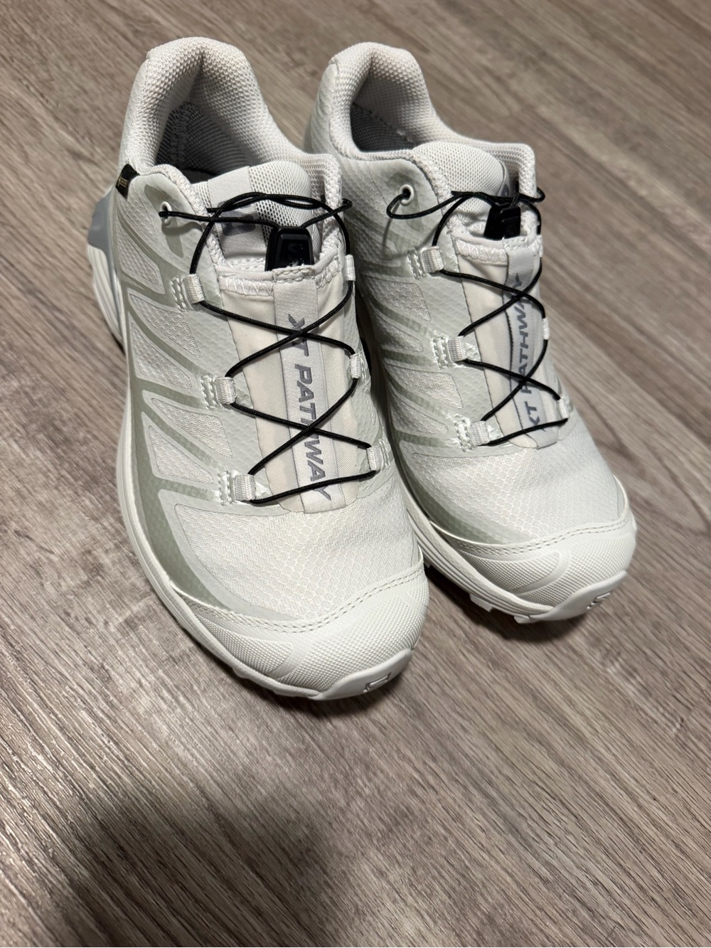 Salomon White Athletic Trail Shoes with Black Laces